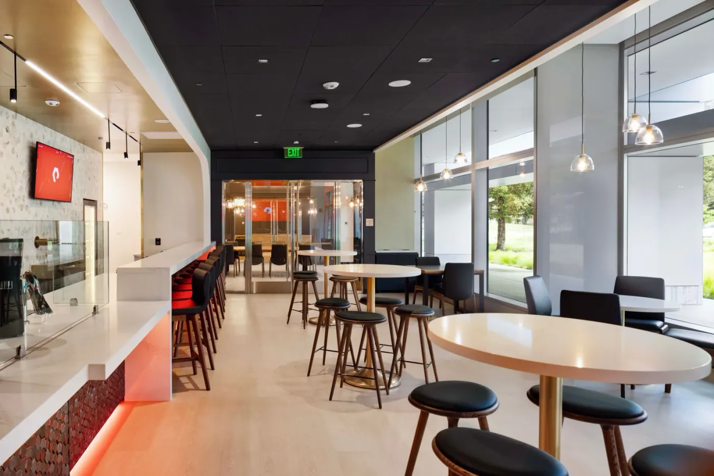 Restaurant interior with customer seating and a service counter